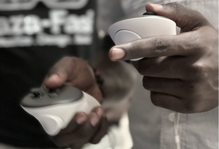 Hands holding VR controller